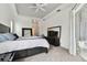 Bright bedroom with a king-size bed and access to a patio at 609 Salt Lake Dr, Tarpon Springs, FL 34689