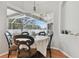 Casual dining area with backyard and pool view at 609 Salt Lake Dr, Tarpon Springs, FL 34689