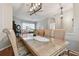 Spacious dining room with a glass-top table, and seating for eight at 609 Salt Lake Dr, Tarpon Springs, FL 34689
