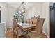 Elegant dining room with a large table, seating for eight, and hardwood floors at 609 Salt Lake Dr, Tarpon Springs, FL 34689