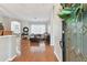 Home entryway with hardwood floors and living room view at 609 Salt Lake Dr, Tarpon Springs, FL 34689