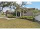 House exterior with landscaping and walkway at 609 Salt Lake Dr, Tarpon Springs, FL 34689