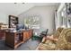 Home office with large desk, computer, and ample storage at 609 Salt Lake Dr, Tarpon Springs, FL 34689