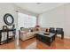 Relaxing living room with hardwood floors, comfy sofa, and sliding glass doors at 609 Salt Lake Dr, Tarpon Springs, FL 34689