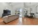 Bright living room with hardwood floors, access to lanai and pool at 609 Salt Lake Dr, Tarpon Springs, FL 34689