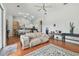 Open living room with hardwood floors and view of kitchen at 609 Salt Lake Dr, Tarpon Springs, FL 34689
