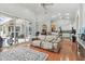Comfortable living room with hardwood floors and pool access at 609 Salt Lake Dr, Tarpon Springs, FL 34689