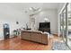 Spacious living area with hardwood floors and ceiling fan at 609 Salt Lake Dr, Tarpon Springs, FL 34689