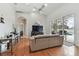 Relaxing living room with hardwood floors and sliding doors to the pool at 609 Salt Lake Dr, Tarpon Springs, FL 34689