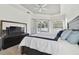 Bright main bedroom with king-size bed and sliding doors to the pool at 609 Salt Lake Dr, Tarpon Springs, FL 34689