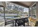 Screened patio with table and chairs overlooking the pool at 609 Salt Lake Dr, Tarpon Springs, FL 34689