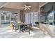 Outdoor patio with table, chairs, and pool view at 609 Salt Lake Dr, Tarpon Springs, FL 34689