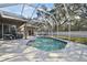 Refreshing screened pool with large backyard at 609 Salt Lake Dr, Tarpon Springs, FL 34689