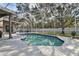 Inviting screened pool with surrounding patio at 609 Salt Lake Dr, Tarpon Springs, FL 34689