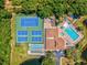 Aerial view of tennis, shuffleboard, and pool at 6428 Gloria Dr # 26, New Port Richey, FL 34653