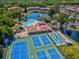 Aerial view of community pool, tennis, and bocce at 6428 Gloria Dr # 26, New Port Richey, FL 34653