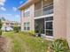Ground floor condo with a screened patio and a small backyard at 6428 Gloria Dr # 26, New Port Richey, FL 34653