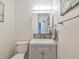 Small half bathroom with modern vanity and fixtures at 6428 Gloria Dr # 26, New Port Richey, FL 34653