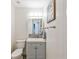 Small half bathroom with modern vanity and fixtures at 6428 Gloria Dr # 26, New Port Richey, FL 34653