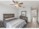 Spacious bedroom with wood-look floors and ceiling fan at 6428 Gloria Dr # 26, New Port Richey, FL 34653
