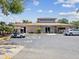 Community building with parking and golf cart at 6428 Gloria Dr # 26, New Port Richey, FL 34653