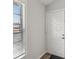 Entryway with white door and window with blinds at 6428 Gloria Dr # 26, New Port Richey, FL 34653