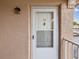 White front door with glass panel and exterior light at 6428 Gloria Dr # 26, New Port Richey, FL 34653