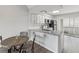 Eat-in kitchen with granite countertops and white shaker cabinets at 6428 Gloria Dr # 26, New Port Richey, FL 34653