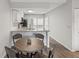 Eat-in kitchen with granite countertops and white shaker cabinets at 6428 Gloria Dr # 26, New Port Richey, FL 34653