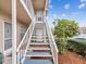 Exterior condo staircase leading to second-floor units at 6428 Gloria Dr # 26, New Port Richey, FL 34653