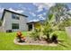 Landscaped backyard with lush greenery at 8424 Bluevine Sky Dr, Land O Lakes, FL 34637