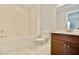 Clean bathroom with tub and vanity at 8424 Bluevine Sky Dr, Land O Lakes, FL 34637