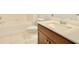 Clean bathroom with a vanity, toilet, and bathtub at 8424 Bluevine Sky Dr, Land O Lakes, FL 34637