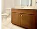 Guest bathroom with single vanity and toilet at 8424 Bluevine Sky Dr, Land O Lakes, FL 34637