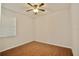 Spacious bedroom with wood-look flooring at 8424 Bluevine Sky Dr, Land O Lakes, FL 34637