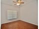 Simple bedroom with wood-look flooring at 8424 Bluevine Sky Dr, Land O Lakes, FL 34637