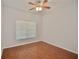 Bright bedroom with wood flooring and ceiling fan at 8424 Bluevine Sky Dr, Land O Lakes, FL 34637
