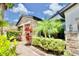 House exterior with stone accents and lush landscaping at 8424 Bluevine Sky Dr, Land O Lakes, FL 34637