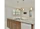 Kitchen island with granite countertop and double sink at 8424 Bluevine Sky Dr, Land O Lakes, FL 34637