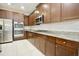 Modern kitchen with stainless steel appliances and granite countertops at 8424 Bluevine Sky Dr, Land O Lakes, FL 34637