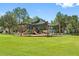 Community playground with shade structure at 8424 Bluevine Sky Dr, Land O Lakes, FL 34637