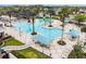 Relaxing resort-style pool with a spacious sundeck and shaded seating areas at 8424 Bluevine Sky Dr, Land O Lakes, FL 34637