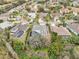 Aerial view of the house and surrounding neighborhood, highlighting its location and landscaping at 8831 Bel Meadow Way, Trinity, FL 34655