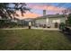 Spacious backyard oasis with a screened-in pool and patio at 8831 Bel Meadow Way, Trinity, FL 34655