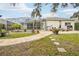 Backyard with a pool, patio, and lush landscaping at 8831 Bel Meadow Way, Trinity, FL 34655