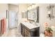 Well-appointed bathroom with marble vanity and exterior access at 8831 Bel Meadow Way, Trinity, FL 34655