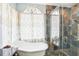 Relaxing bathroom with soaking tub and glass-enclosed shower at 8831 Bel Meadow Way, Trinity, FL 34655