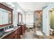 Luxurious bathroom with a freestanding tub and walk-in shower at 8831 Bel Meadow Way, Trinity, FL 34655