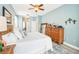 Comfortable main bedroom with ceiling fan and dresser at 8831 Bel Meadow Way, Trinity, FL 34655