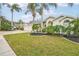 Landscaped yard and two-car garage at 8831 Bel Meadow Way, Trinity, FL 34655